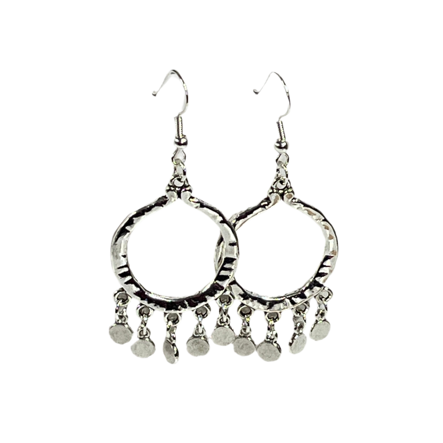 Pair of silver hoop earrings with dangling silver coins on a white background