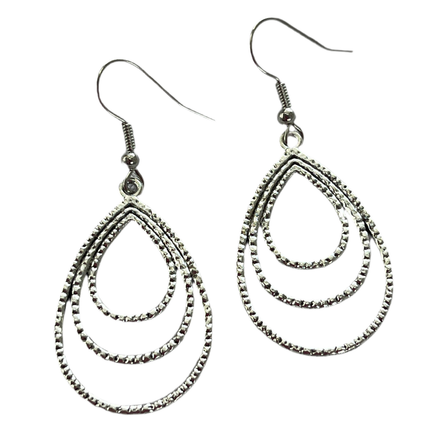 Pair of silver triple wire teardrop earrings on a white background
