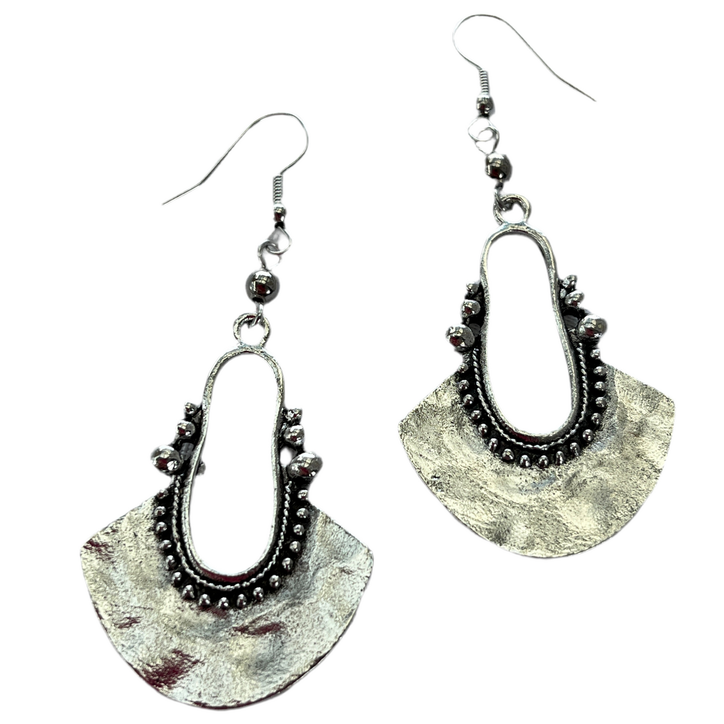 Pair of silver antique look earrings on a white background