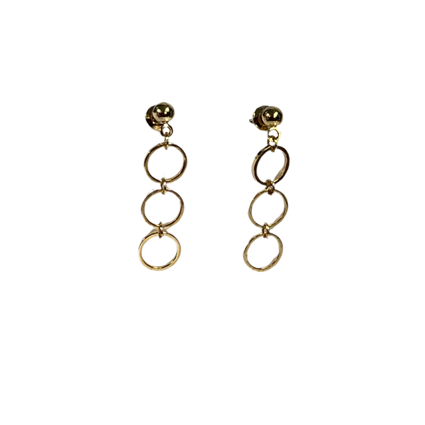 Gold circular earrings on a white background
