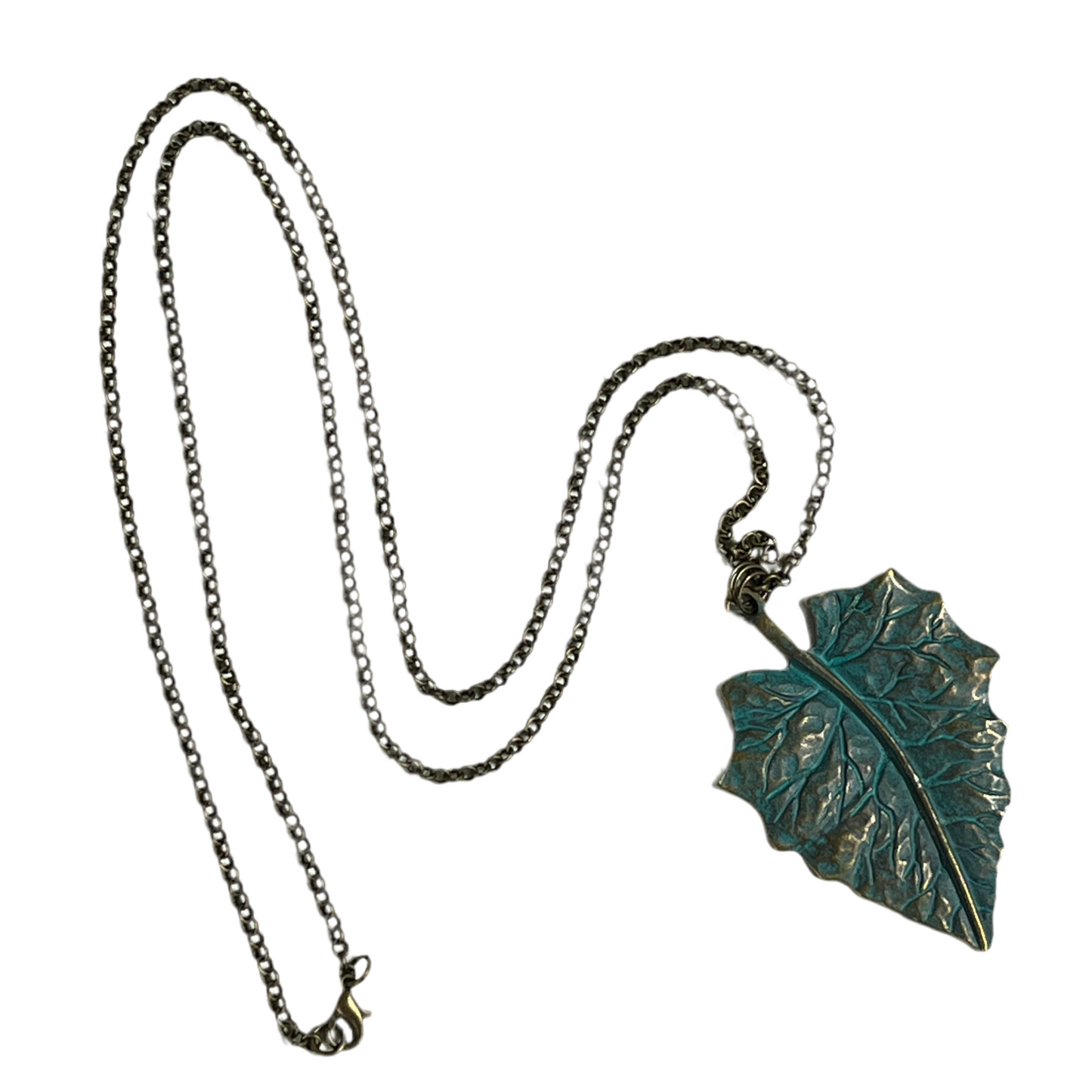 Leaf-shaped pendant on a chain against a white background