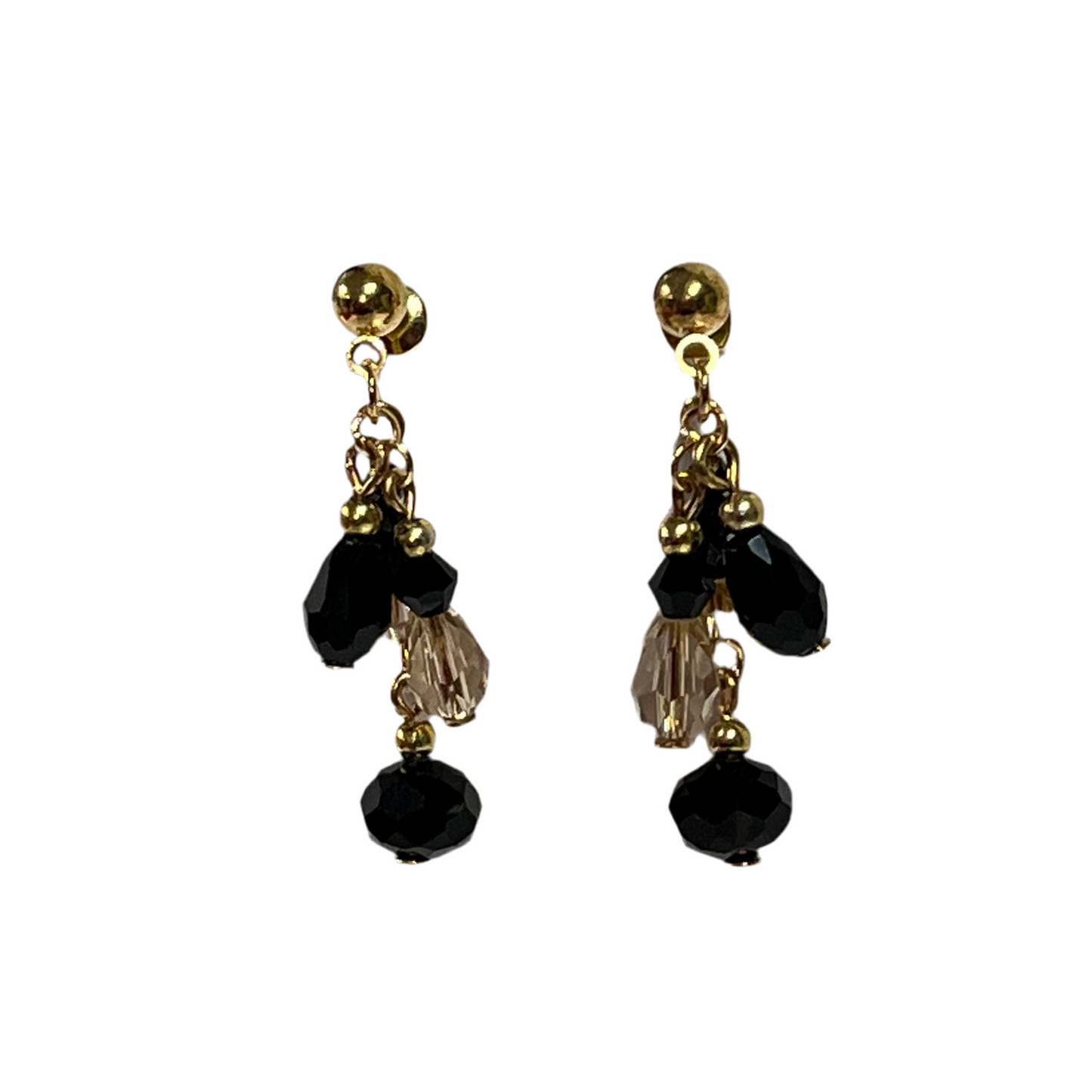 Gold and black beaded earrings on a white background