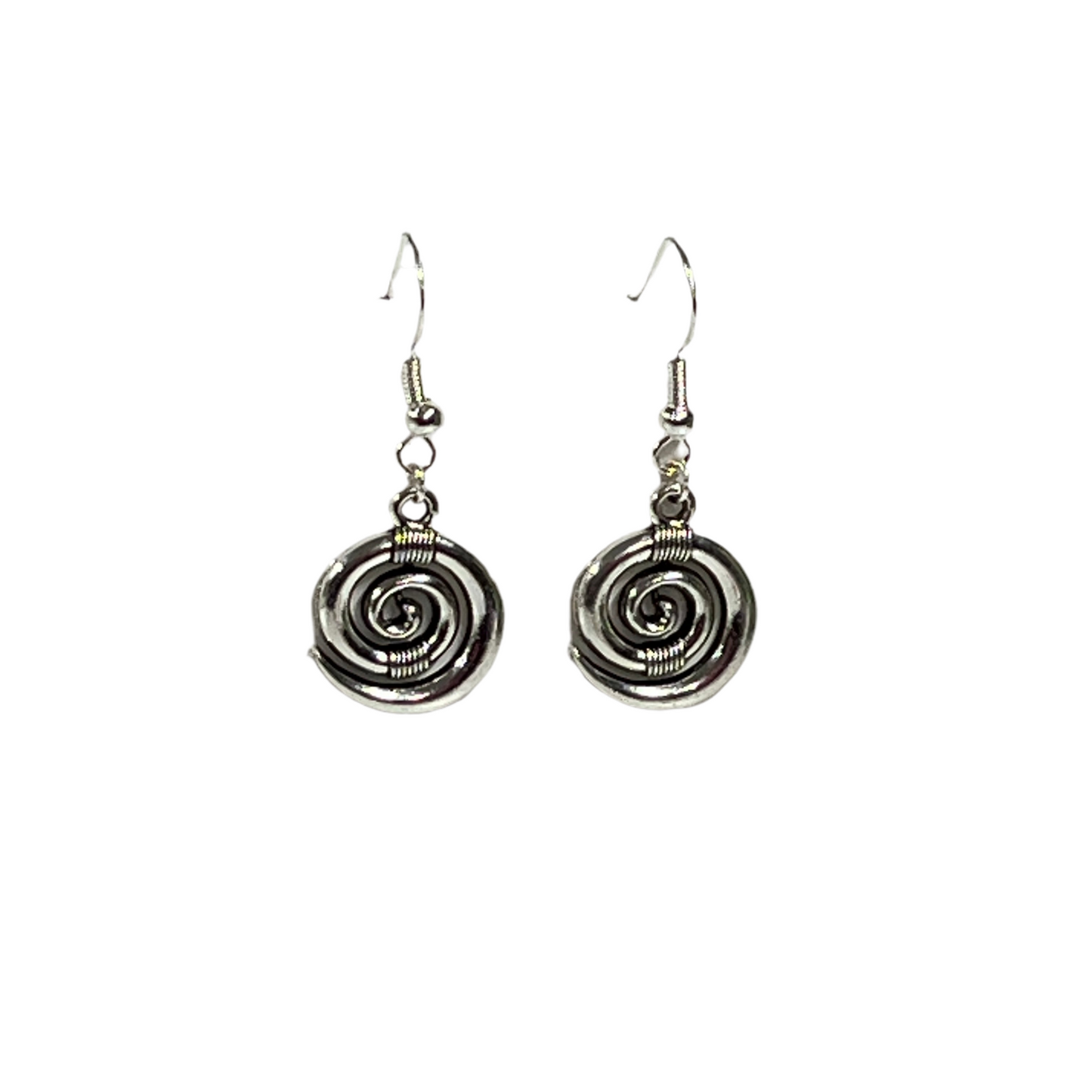 Pair of silver koru spiral earrings on a white background