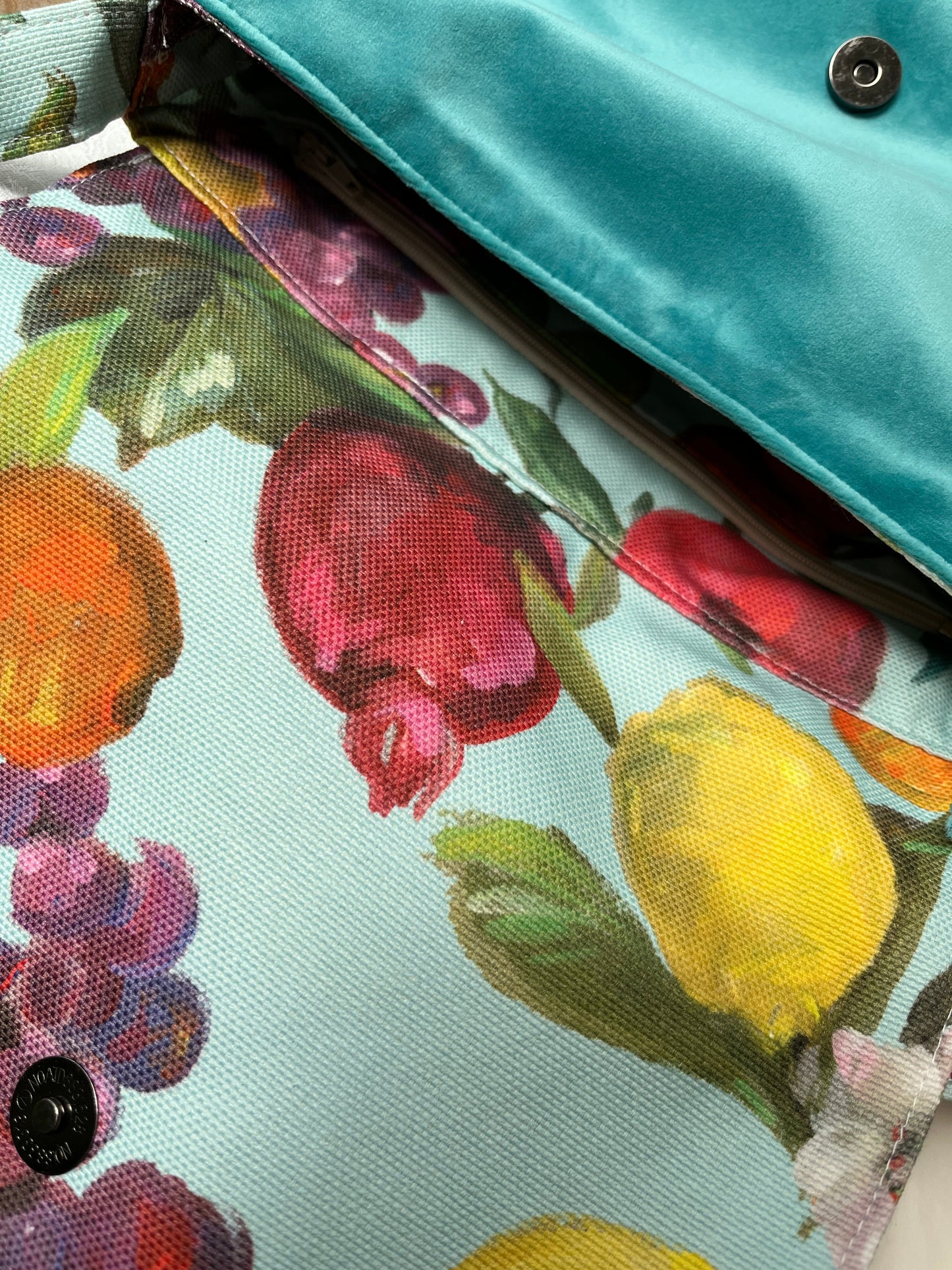 Floral fruit print canvas handbag with teal polyester velour base, handmade in New Zealand by LouLou