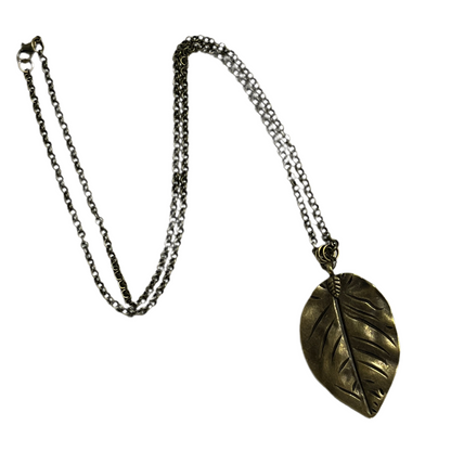 Necklace with a leaf-shaped pendant on a white background