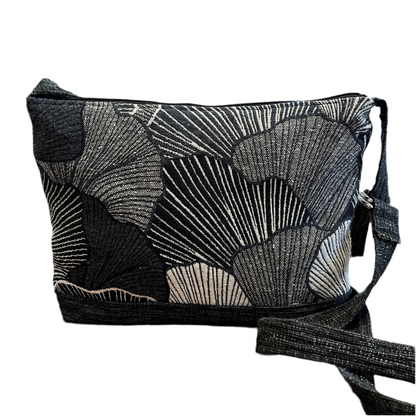 Black and white Gingko leaf patterned crossbody bag on a white background
