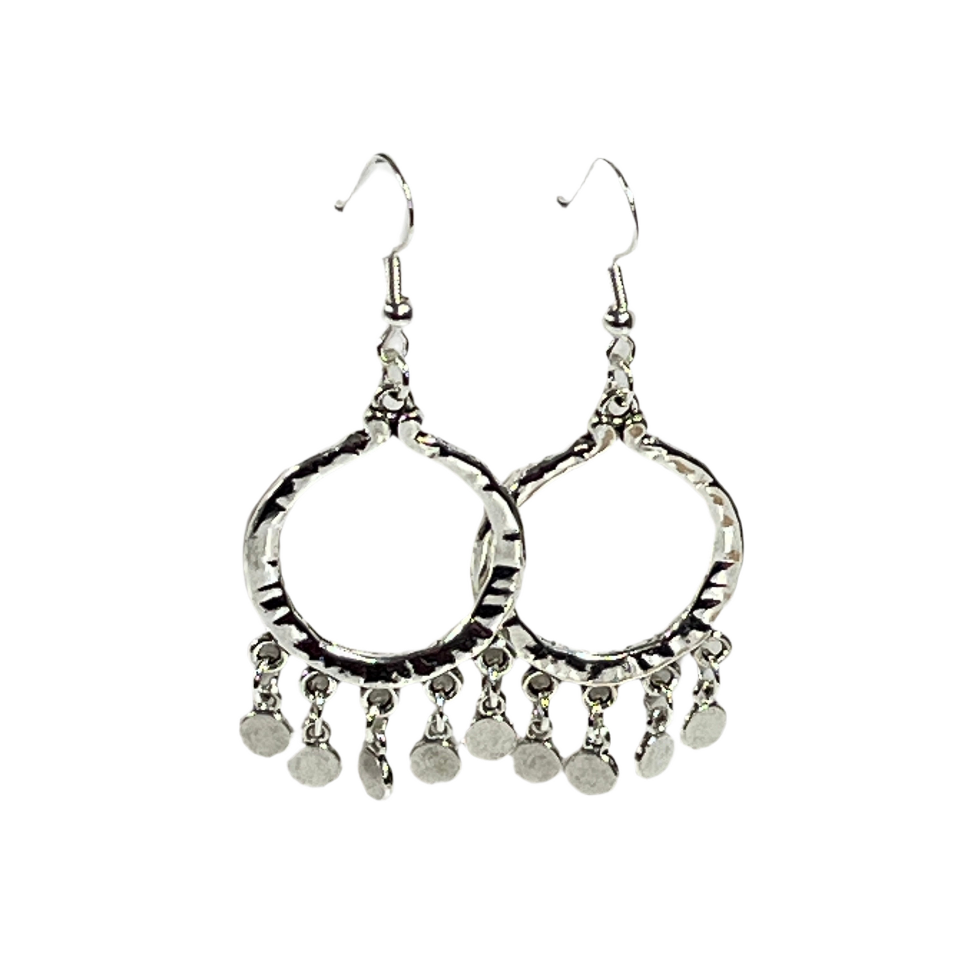 Pair of silver hoop earrings with dangling silver coins on a white background