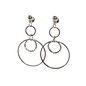 Pair of hoop earrings with smaller circular charms on a white background