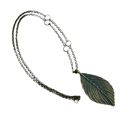 Necklace with a leaf-shaped pendant on a white background