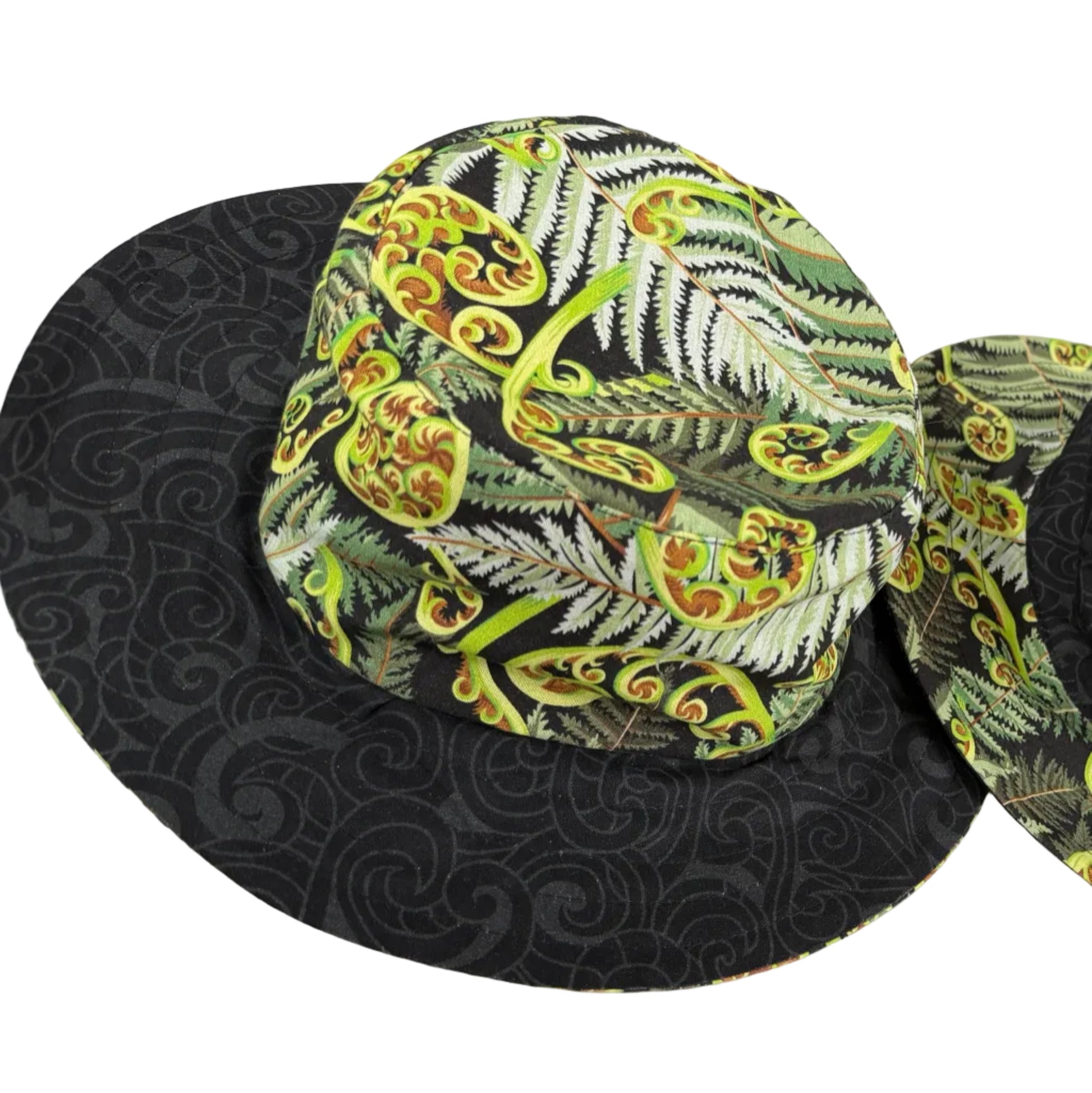 Sun Hat fern koru patterns on a black base