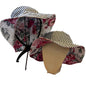 Floral-patterned sun hats with black and white striped brims on a mannequin head.