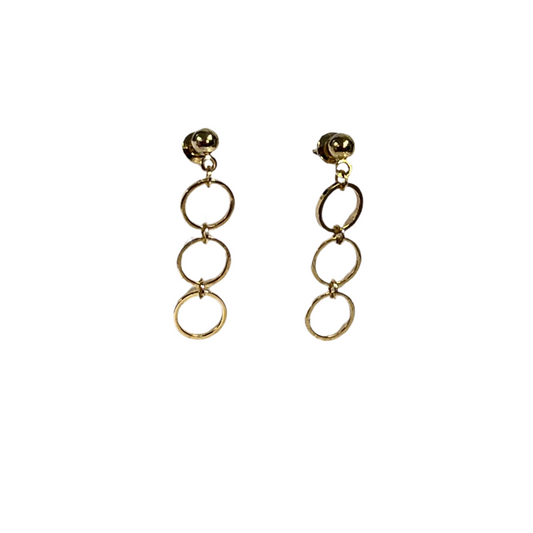 Gold circular earrings on a white background