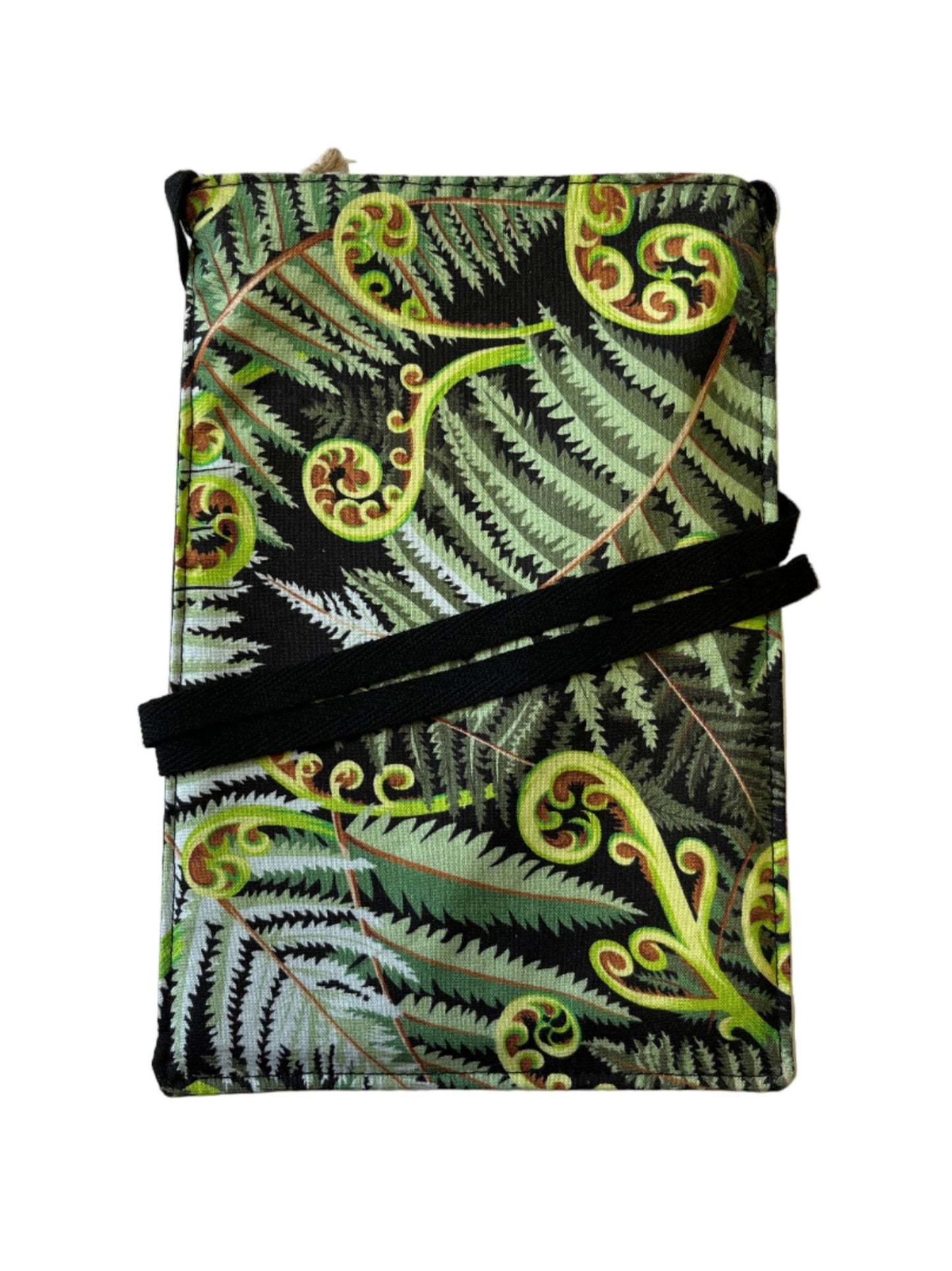 Front view of handmade mobile phone bag with bold green koru fern pattern on black background.