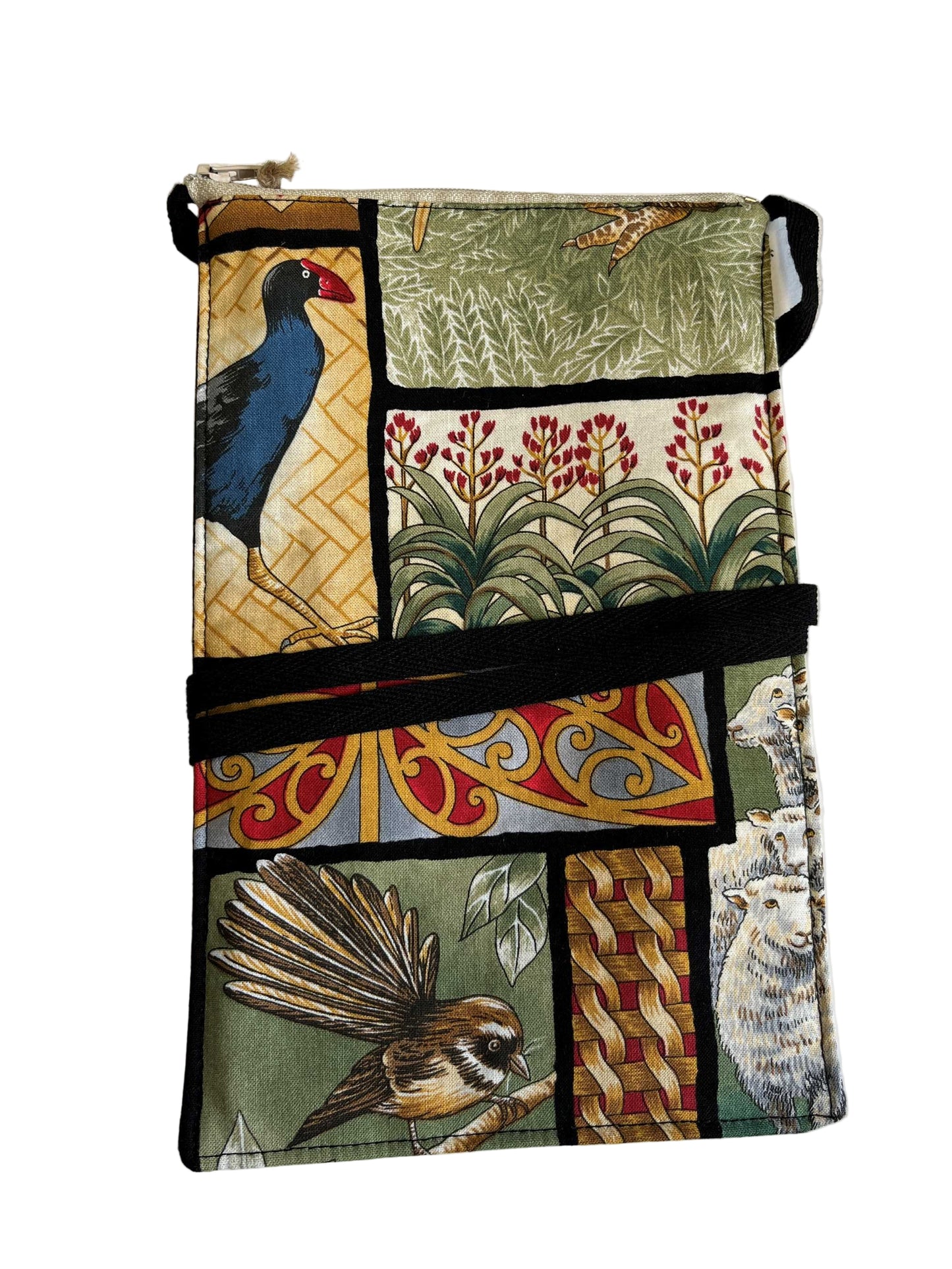 Handmade mobile phone bag with Kiwiana patchwork print featuring pūkeko, pīwakawaka, sheep, and native flora.