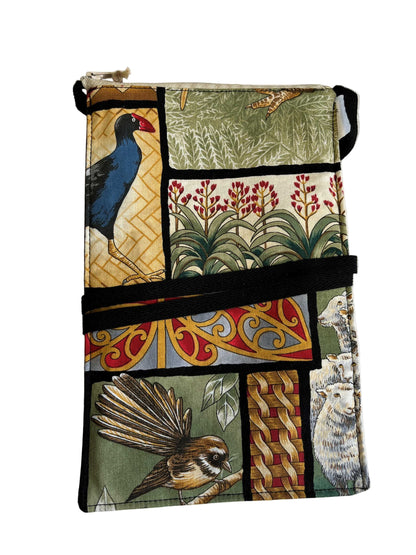 Handmade mobile phone bag with Kiwiana patchwork print featuring pūkeko, pīwakawaka, sheep, and native flora.