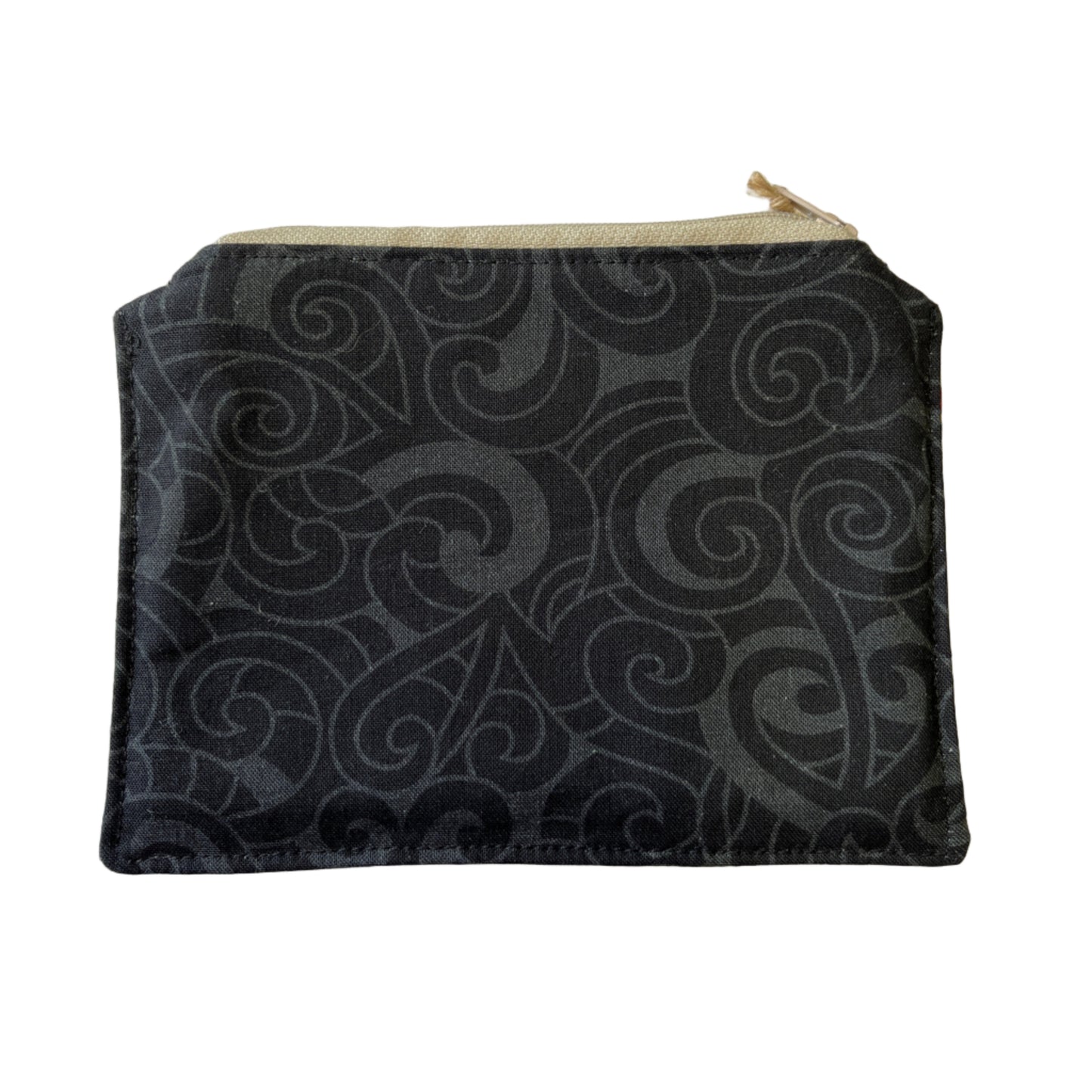 Black zip purse with subtle Māori koru pattern in charcoal tones, made from cotton fabric.