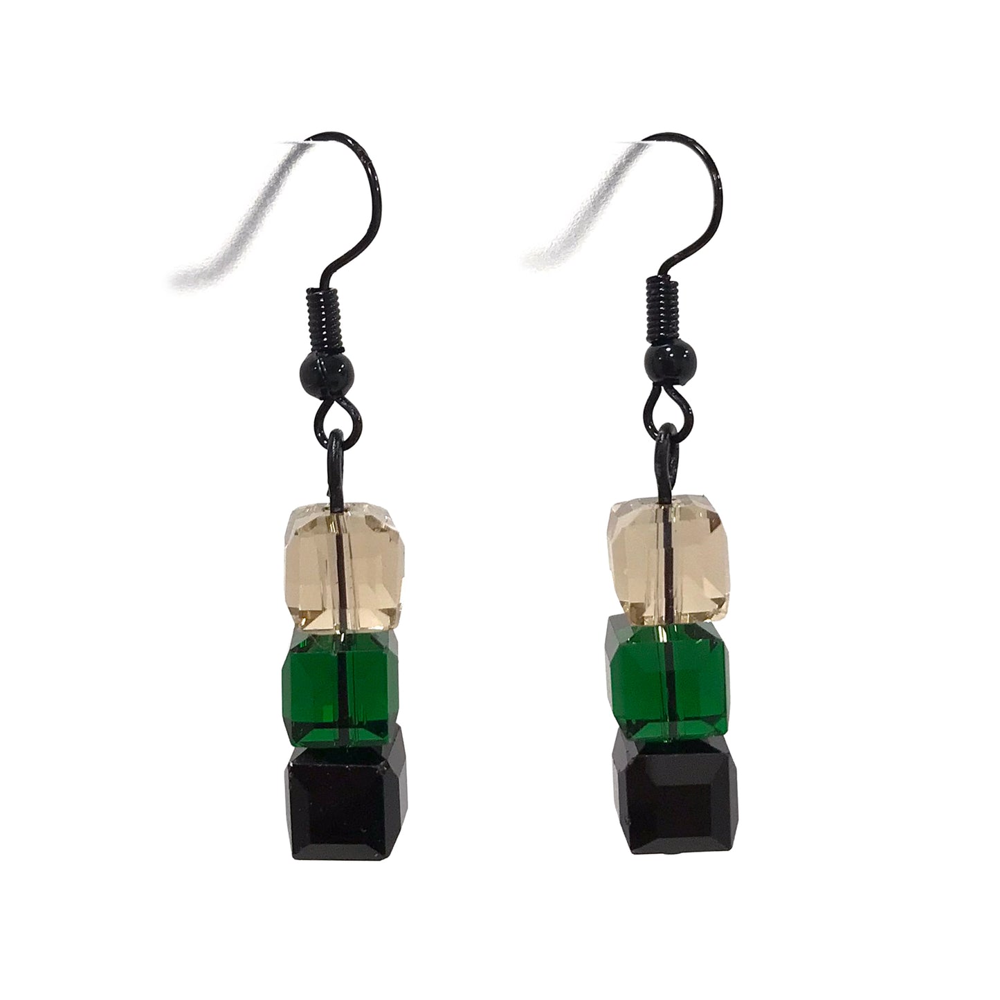 Pair of earrings with green, black, and champagne square beads on a white background