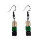 Pair of earrings with green, black, and champagne square beads on a white background