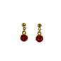 Gold earrings with red gemstones on a white background