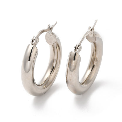 A pair of stainless steel hoop earrings with a shiny finish on a white background.