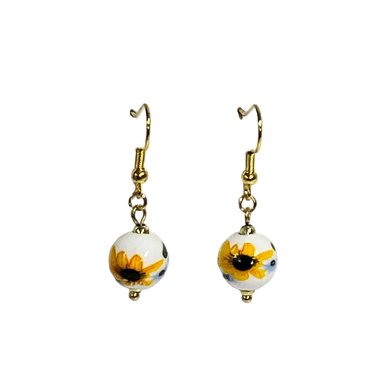 Pair of earrings with sunflower design on ceramic bead