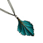 Verdigris leaf-shaped pendant on a bronze chain