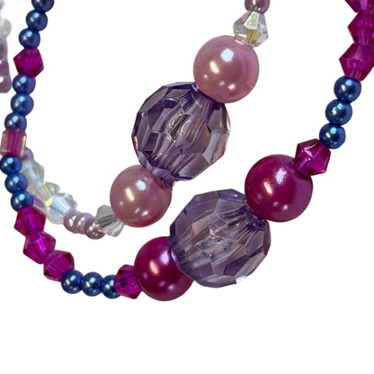 Beaded bracelet with pink, purple, and clear beads
