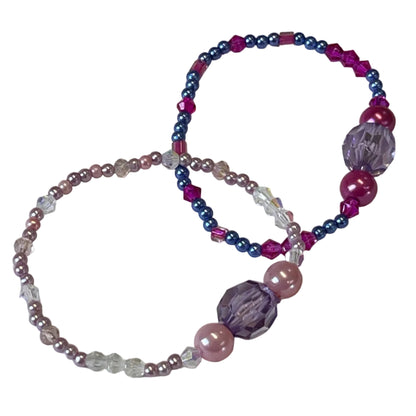 Two beaded bracelets with pink, purple, and clear beads 