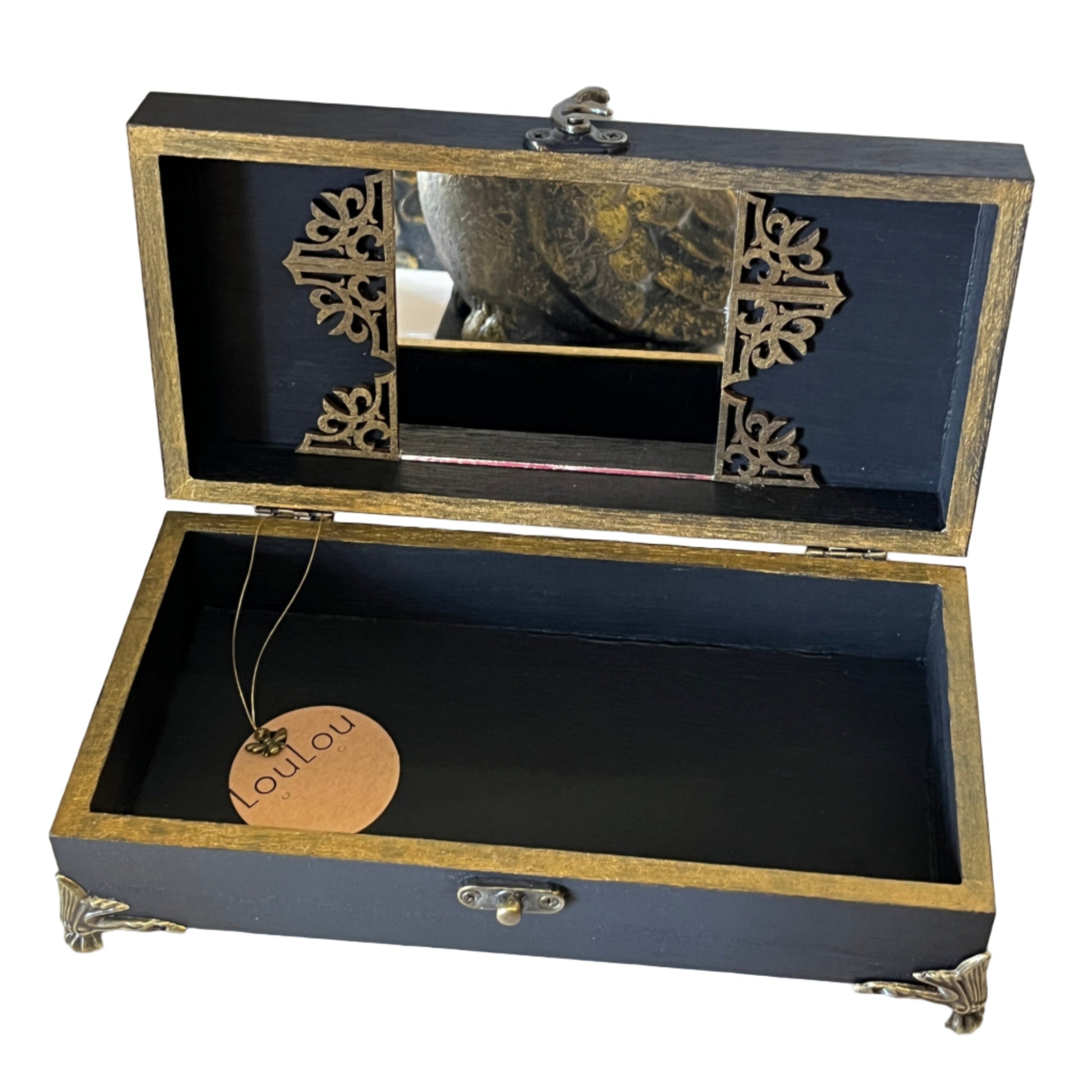 Open jewelry box with decorative elements gold ornate with mirror