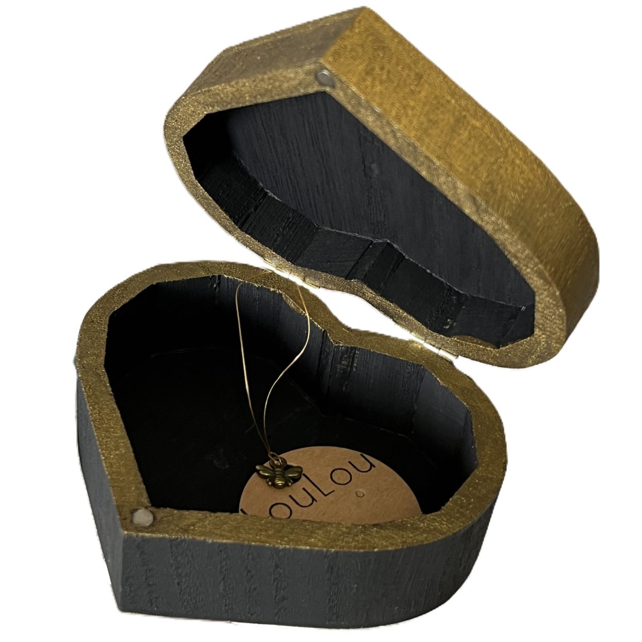 Heart-shaped wooden jewelry box with a black and gold painted, branded 'Loulou'.