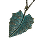 Bronze leaf-shaped pendant on a chain against a white background