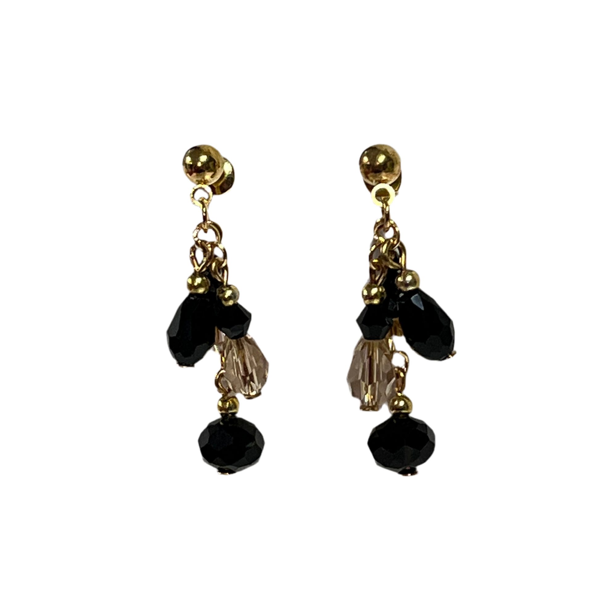 Gold and black beaded earrings on a white background