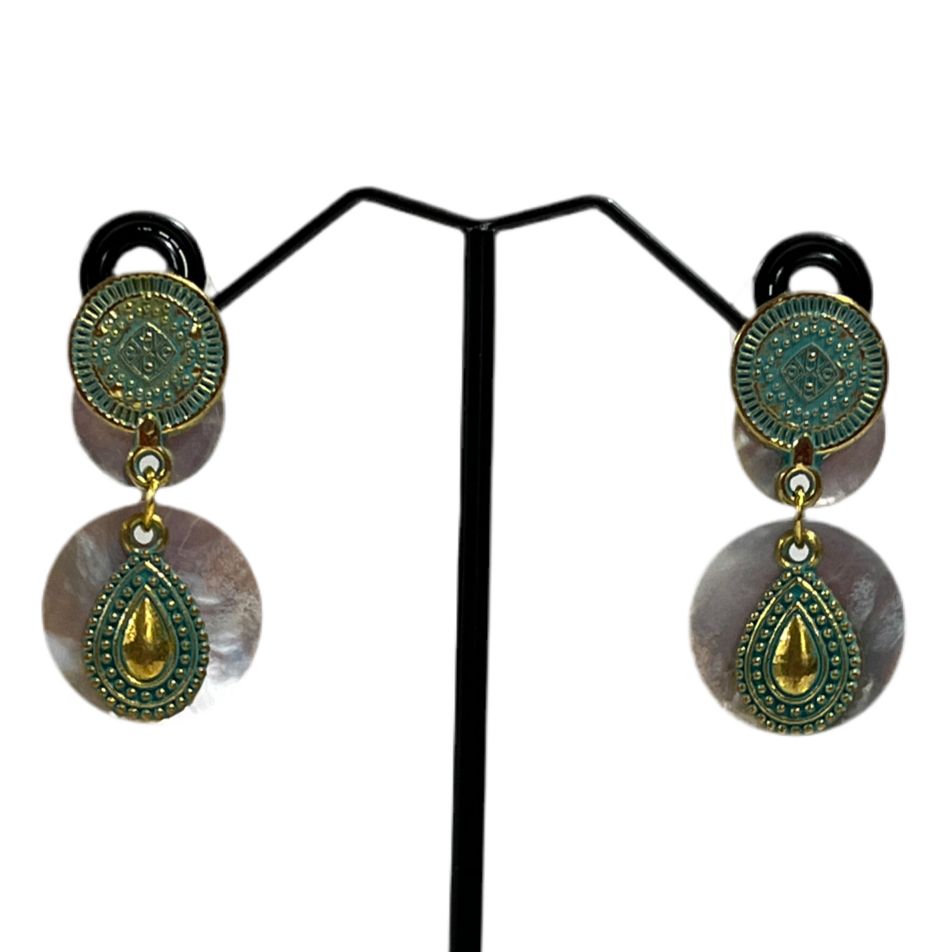 Pair of earrings with green and gold circular designs shell with teardrops 
on a white background