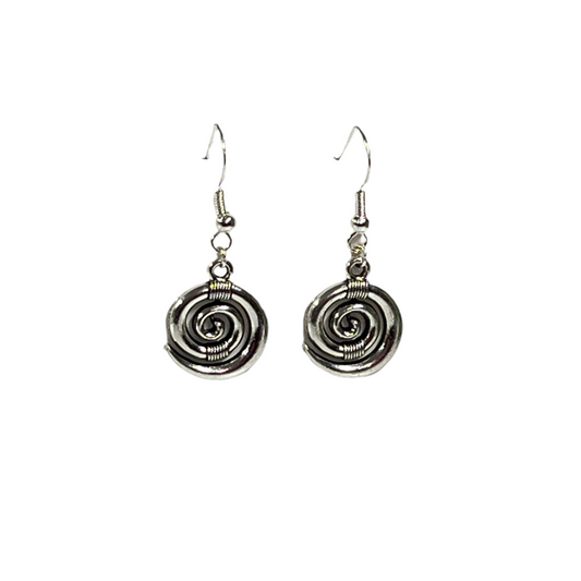 Pair of silver koru spiral earrings on a white background
