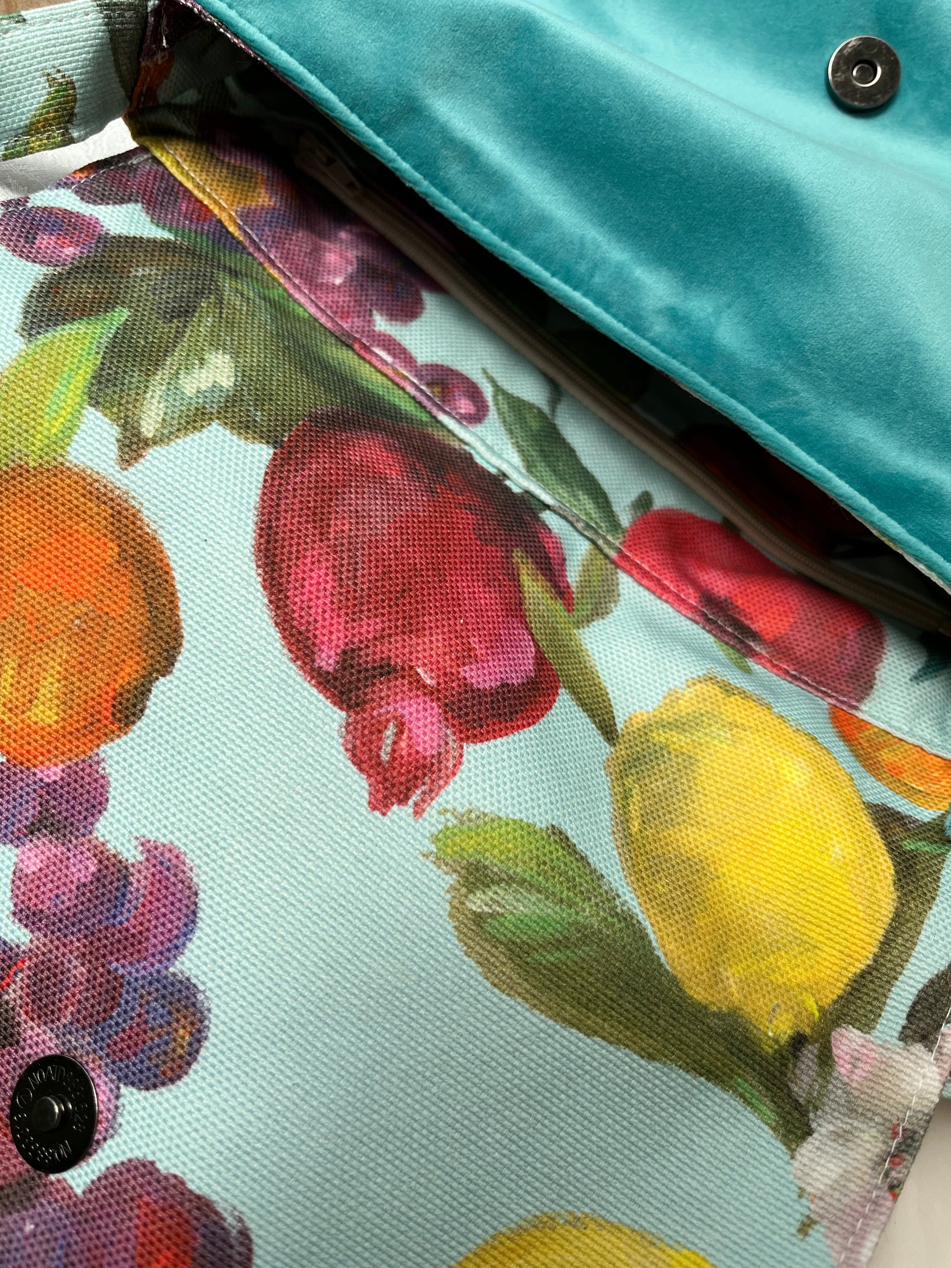 Floral fruit print canvas handbag with teal polyester velour base, handmade in New Zealand by LouLou