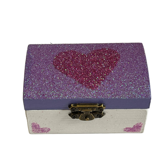 Small wooden box with a glittery purple top and white base, featuring a heart design.
